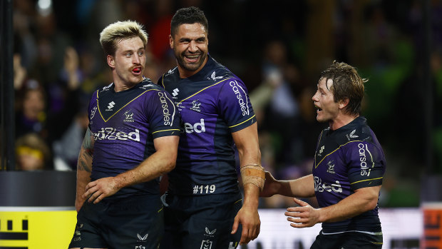 Cameron Munster celebrates a try with teammate Jesse Bromwich.