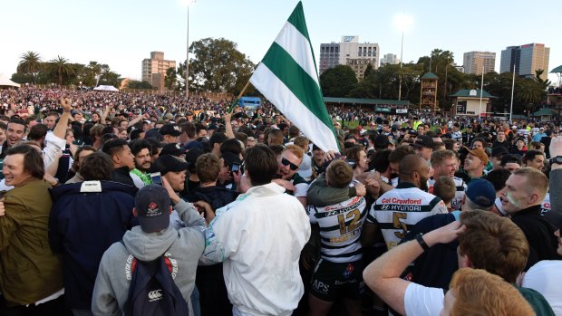 History: Warringah supporters swarm North Sydney Oval after club's first Shute Shield win in 12 years. 