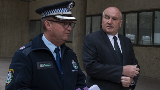 Police Minister David Elliott, pictured with Acting Assistant Police Commissioner Tony Cooke, renewed his warning for businesses and their patrons to comply with public health orders.