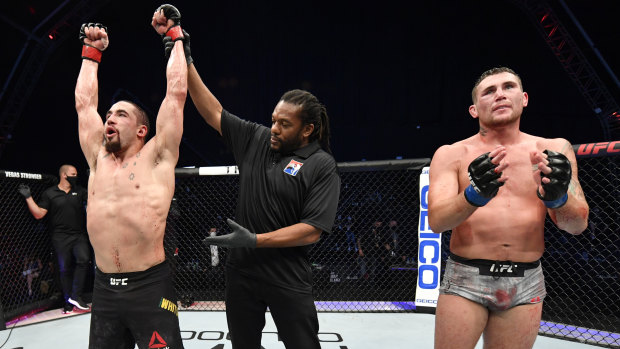 Australian UFC star Robert Whittaker celebrates after his win over Darren Till.