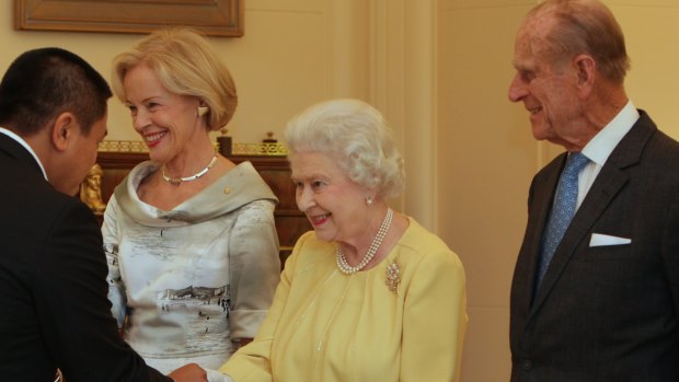 The Queen shakes hands with author and comedian, Anh Do, at a lunch at Government House in Canberra in 2011. The lunch was hosted by Quentin Bryce, left, who was governor-general at the time. Prince Philip is also pictured.