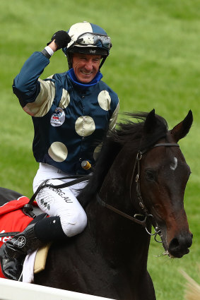 A jubilant Glen Boss celebrates after winning the Cox Plate on Sir Dragonet.