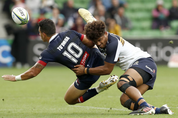 Rob Valetini of the Brumbies tackles Matt To’omua of the Rebels during the round nine Super RugbyAU match between the ACT Brumbies and the Melbourne Rebels.
