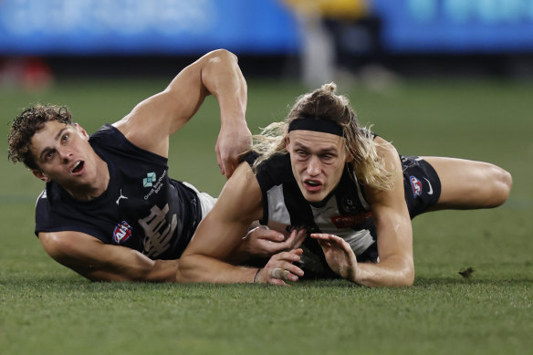 Collingwood retained breathing space on top despite losing to Carlton.