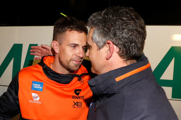 Brett Deledio, left, with Giants coach Leon Cameron, right, last year. Deledio had joined Hawthorn as a development coach but has been let go. 