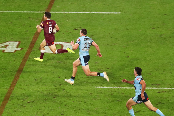 As close as he’ll get... Isaah Yeo tries in vain to keep up with Hunt on his way into the history books.