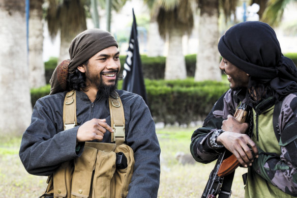 Neil Prakash (left) in a jihadist propaganda video in about 2015.