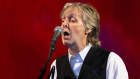 Paul McCartney performing in June at Glastonbury Festival in England: he has got his hair dye just right, blending in tawny shades with his natural grey.