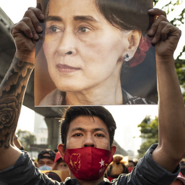 A demonstrator holds up a poster of Aung San Suu Kyi outside the Embassy of Myanmar in Bangkok, Thailand, on February 1.