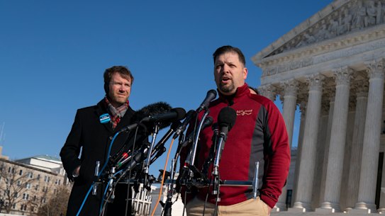 Brandon Trosclair, a grocery store owner that is challenging the Biden administrations vaccine mandate, talks to reporters outside the Supreme Court.
