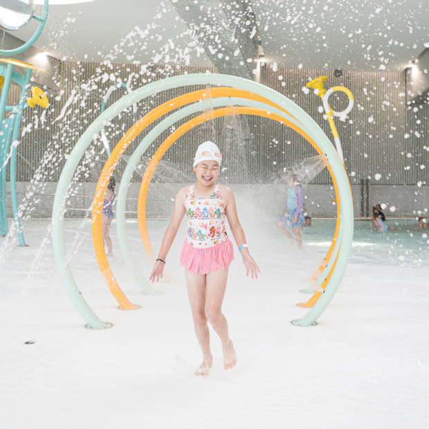 Sienna Yip, 9, trials the children’s splash play area at the aquatic centre.