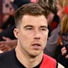 Zach Merrett’s time as Essendon skipper has ended.
