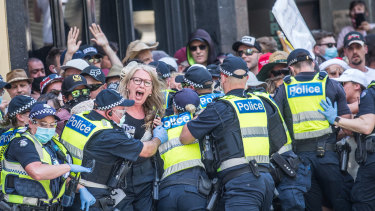 Police encircle protesters as tensions flare at a lockdown protest on November 3.