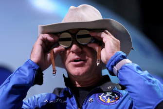 Jeff Bezos, in cowboy hat and Amelia Earhart goggles, has his eyes set on conquering space. 