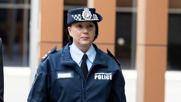AFP acting assistant commissioner Joanne Cameron leaves the inquiry in Canberra on Thursday.