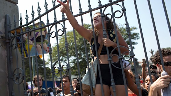 Students and National Museum employees protested outside the institution. 