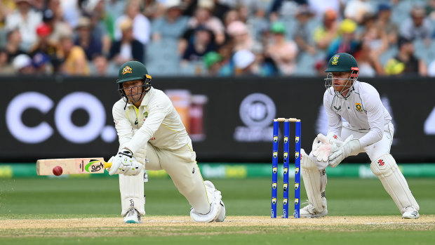 Alex Carey reverse sweeps Keshav Maharaj on his way to a century.