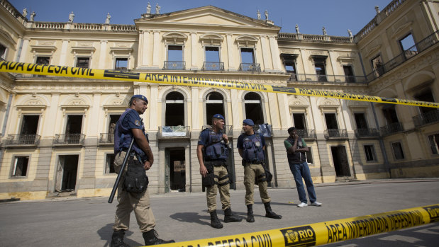 Police guard the museum on Monday.