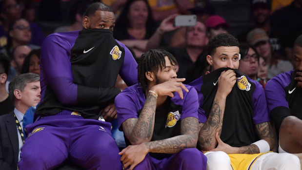 LeBron James (left) on the Lakers' bench with Brandon Ingram (centre) and Kyle Kuzma.