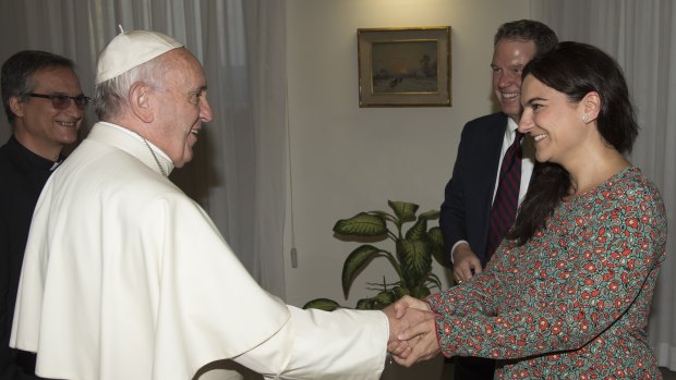 Pope Francis greets Paloma Garcia Ovejero, right, and Greg Burke at the Vatican in 2016.