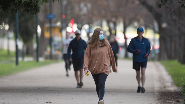 Morning walkers at The Tan in South Yarra.