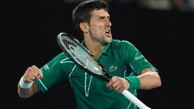 Novak Djokovic celebrates after winning the men's singles semi final against Roger Federer. 