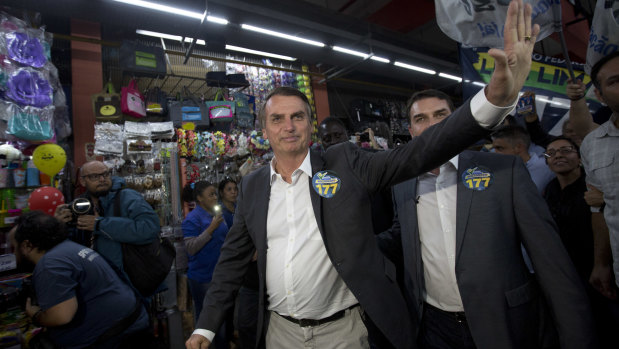 National Social Liberal Party presidential candidate Jair Bolsonaro greets people in Rio de Janeiro.