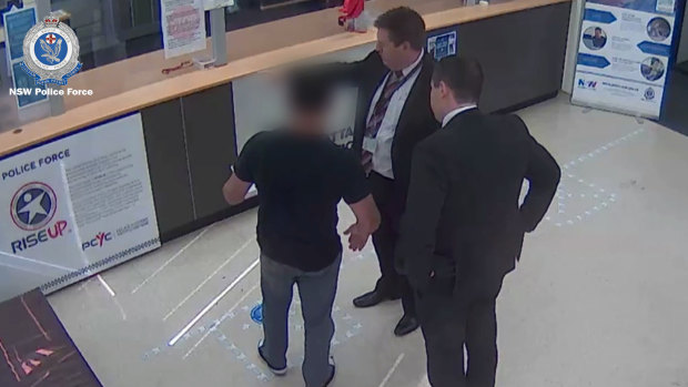 Dennis Pietrobon during his arrest in the foyer of Parramatta police station.