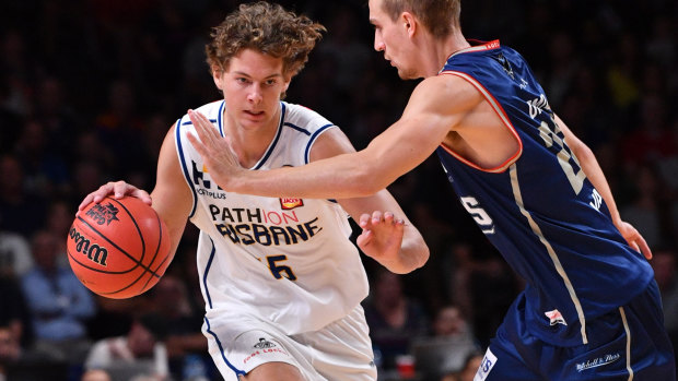 Tom Fullarton (left) in action for the Brisbane Bullets.