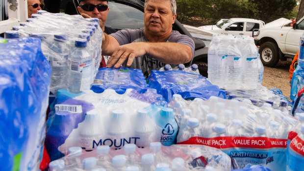 Huge amounts of bottled water have been delivered to towns hit by bushfires, as Coca-Cola Amatil's share price hits five-year highs. 