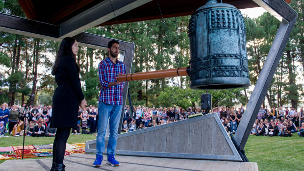 Yasmin and Ali Bulbul ring the Nara peace bell 50 times on Tuesday night for the 50 victims of the Christchurch terrorist attack.
