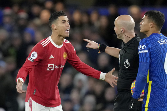 ristiano Ronaldo talks to Referee Anthony Taylor while Chelsea’s Thiago Silva, right, looks on.