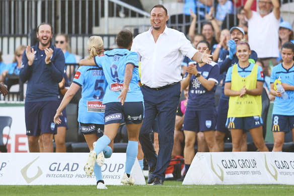 Ally Green of Sydney FC celebrates scoring a goal with coach Ante Juric.