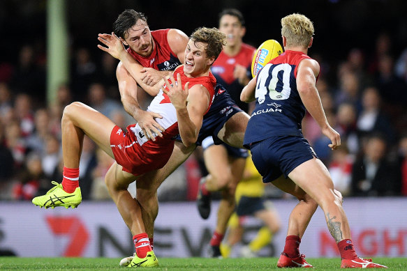 Michael Hibberd, left, tackles Sydney's Jordan Dawson last year, 