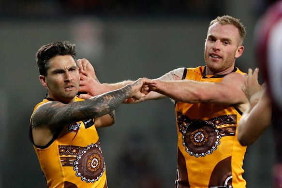 Tom Mitchell and Chad Wingard on Sunday.