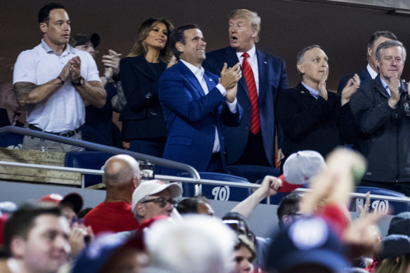 US President Donald Trump, centre, accompanied by first lady Melania Trump and Republican lawmakers, reacts as the stadium boos when he is shown on the giant screen during a baseball World Series game between the Houston Astros and the Washington Nationals at Nationals Park in Washington on Sunday.