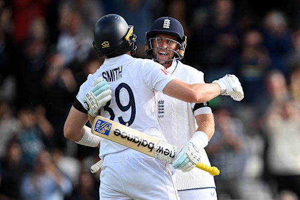 Joe Root and Jamie Smith embrace after England secure victory on day five of their Test against India.
