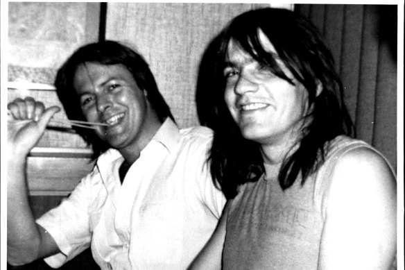 Murder victim Crispin Dye, left, with AC/DC guitarist Malcolm Young.