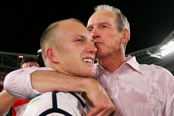 Darren Lockyer and Wayne Bennett celebrate the Broncos 2006 premiership.