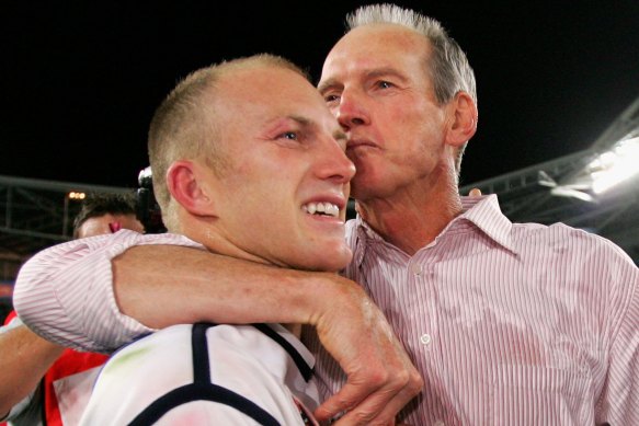 Darren Lockyer and Wayne Bennett celebrate the Broncos’ 2006 premiership triumph.