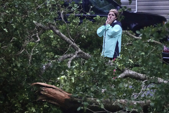 Zuram Rodriguez surveys the damage from Hurricane Ian near her mobile home in Davie, Florida, on Wednesday.