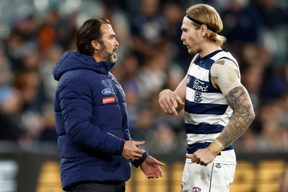 Chris Scott speaks with Cats star Tom Stewart in a break in play during Geelong’s clash with Carlton.