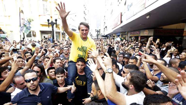 Jair Bolsonaro is taken on the shoulders of a supporter moments before being stabbed during a campaign rally in Juiz de Fora, Brazil.