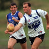 Wayne Carey and Anthony Stevens during their playing days at North Melbourne.