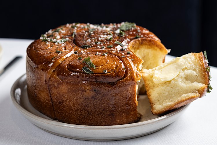 Bread, a crown-shaped brioche brushed with a caramel made from vegetable scraps, is complimentary.