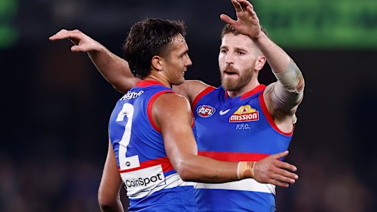 Jamarra Ugle-Hagan celebrates a goal with Marcus Bontempelli.