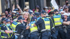 Police encircle protesters as tensions flare at a lockdown protest on November 3.