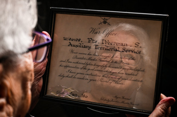 Sonja Cowan with a certificate of merit from the British Army that she earned during World War II.