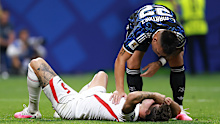 John Stones #5 of England is checked by Lautaro Martinez 