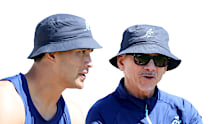 Les Kiss speaks to Joseph-Aukuso Suaalii during a Wallabies training session.